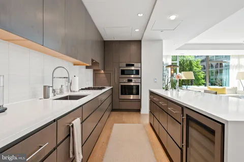 a living room with furniture cabinets and book shelf