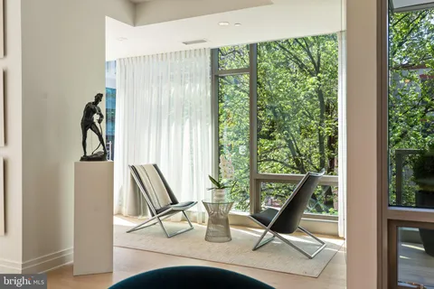 a bed room with a bed and a large window