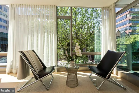 a bathroom with a sink mirror and vanity
