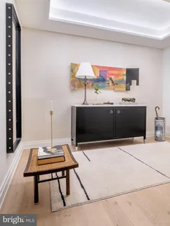 a living room with furniture and large windows