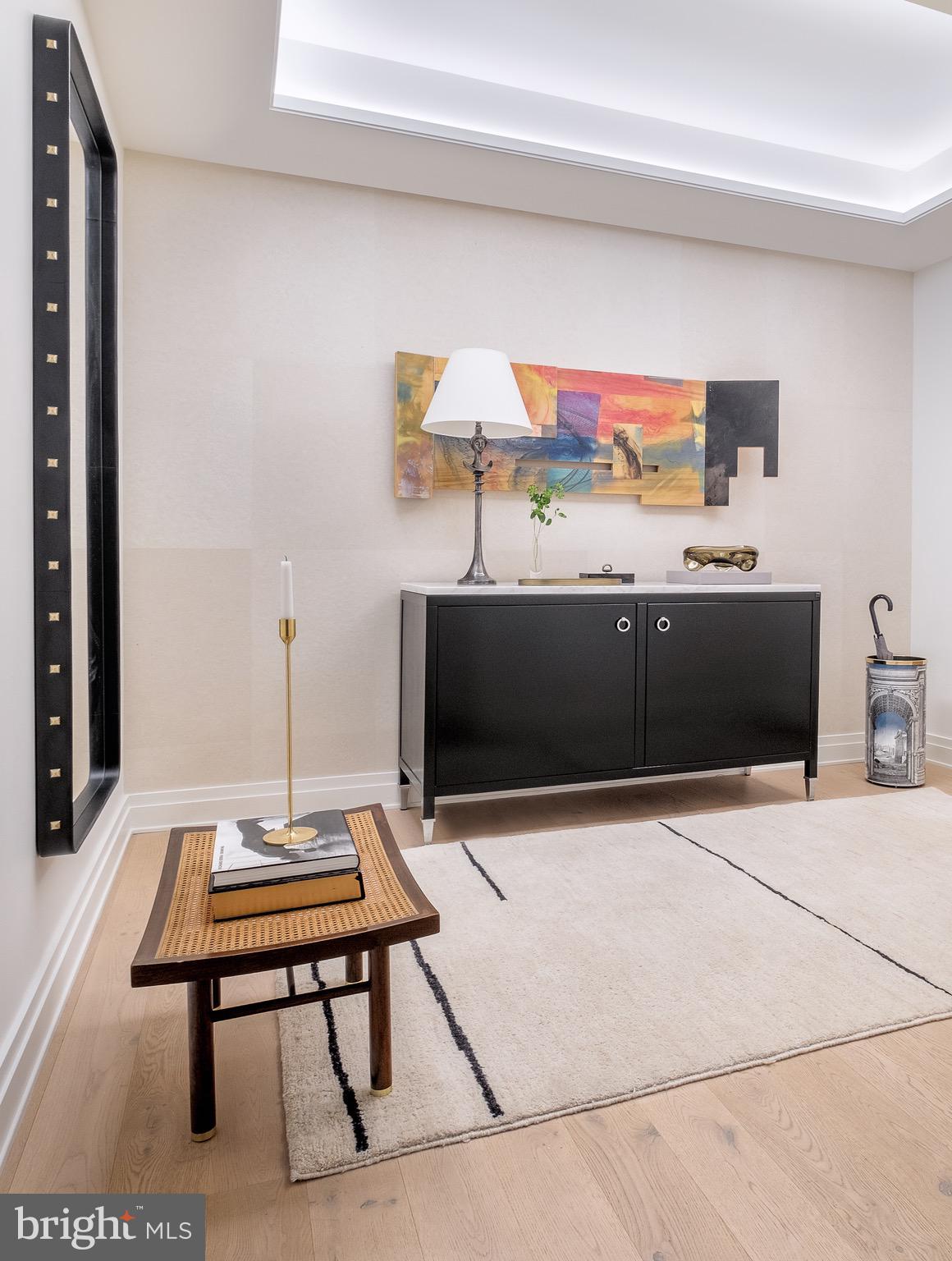 2501 M Street Northwest, Unit 203 Washington, DC 20037 - Photo 6 of 81 a living room with furniture and a flat screen tv