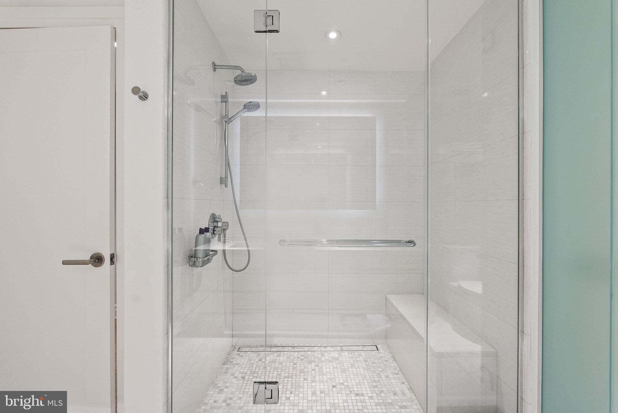 2501 M Street Northwest, Unit 203 Washington, DC 20037 - Photo 64 of 81 a bathroom with a glass shower door