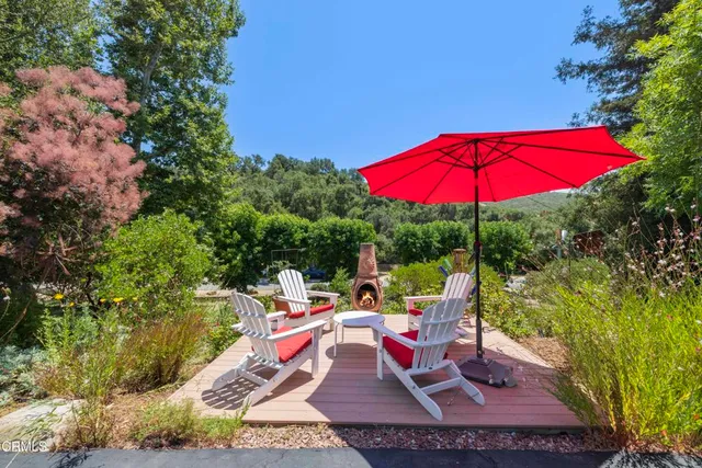 a kitchen with stainless steel appliances granite countertop lots of counter top space and wooden floor