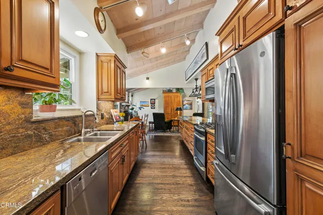 a view of a dining room with furniture and window