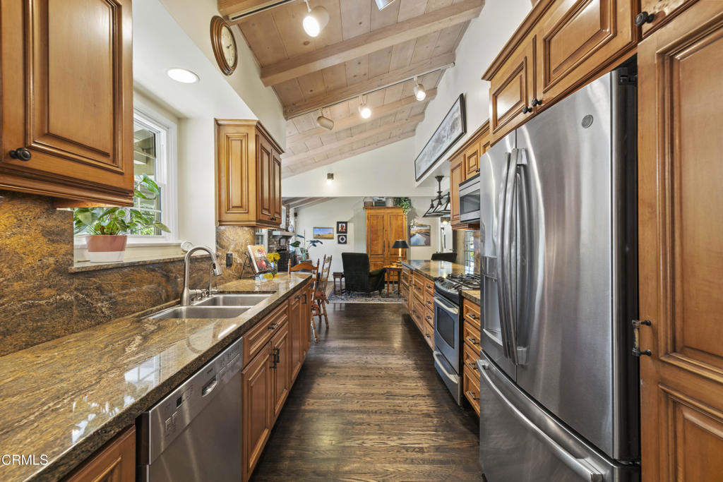 0 Stokes Canyon Road Calabasas, CA 91302 - Photo 19 of 52 a kitchen with stainless steel appliances granite countertop lots of counter top space and wooden floor