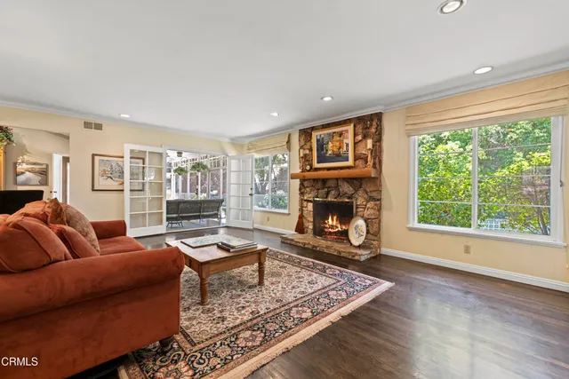 a view of a patio with lawn chairs next to a yard