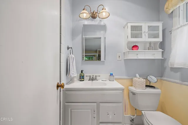 a spacious bedroom with a bed and glass door
