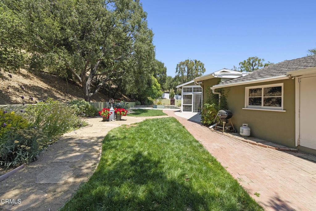 0 Stokes Canyon Road Calabasas, CA 91302 - Photo 45 of 52 a view of a yard with plants and a table and chairs