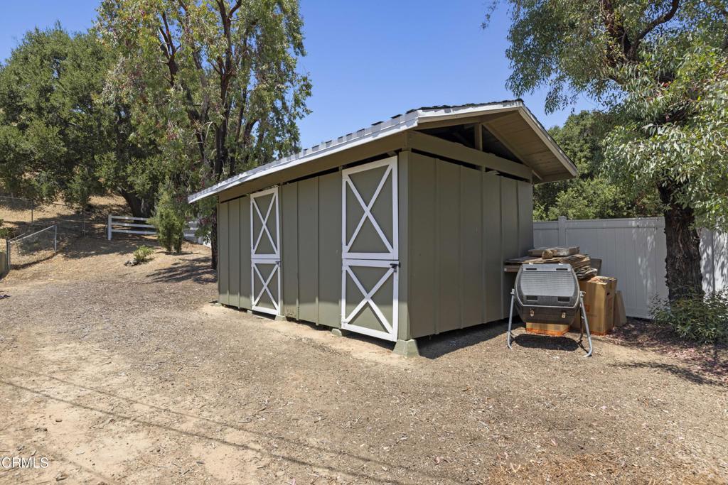 0 Stokes Canyon Road Calabasas, CA 91302 - Photo 48 of 52 a backyard of a house with barbeque oven and trees