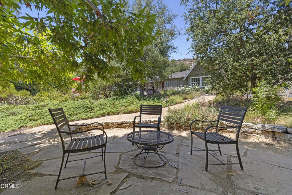 0 Stokes Canyon Road Calabasas, CA 91302 - Photo 49 of 52 a view of a patio with table and chairs and potted plants