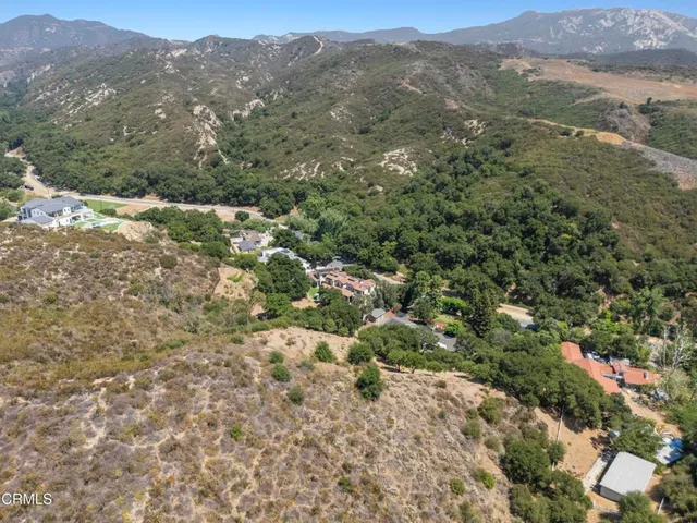 an aerial view of residential house and green space