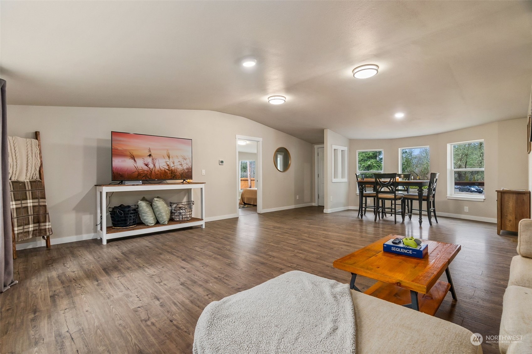 19025 Marble Street Southwest Rochester, WA 98579 - Photo 11 of 26 a living room with furniture and a wooden floor