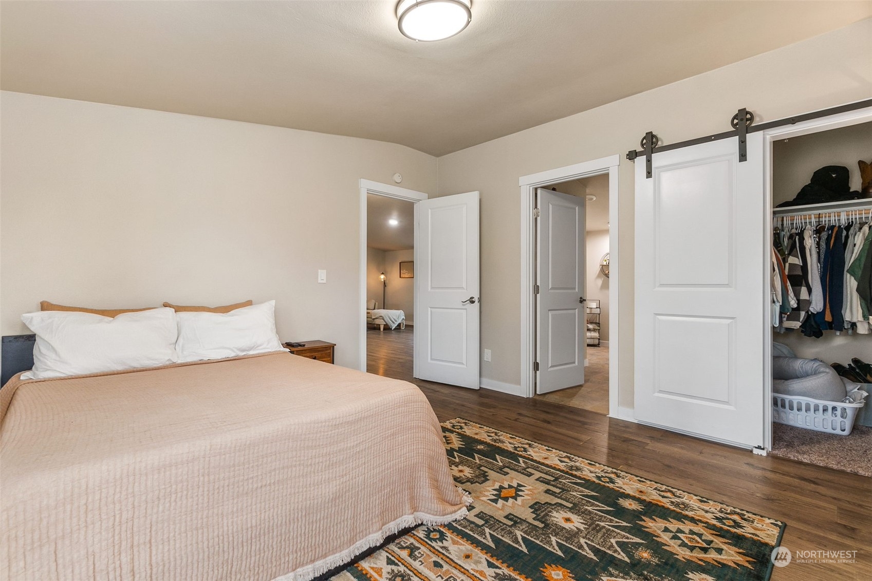 19025 Marble Street Southwest Rochester, WA 98579 - Photo 12 of 26 a bedroom with a bed and a view of walk in closet