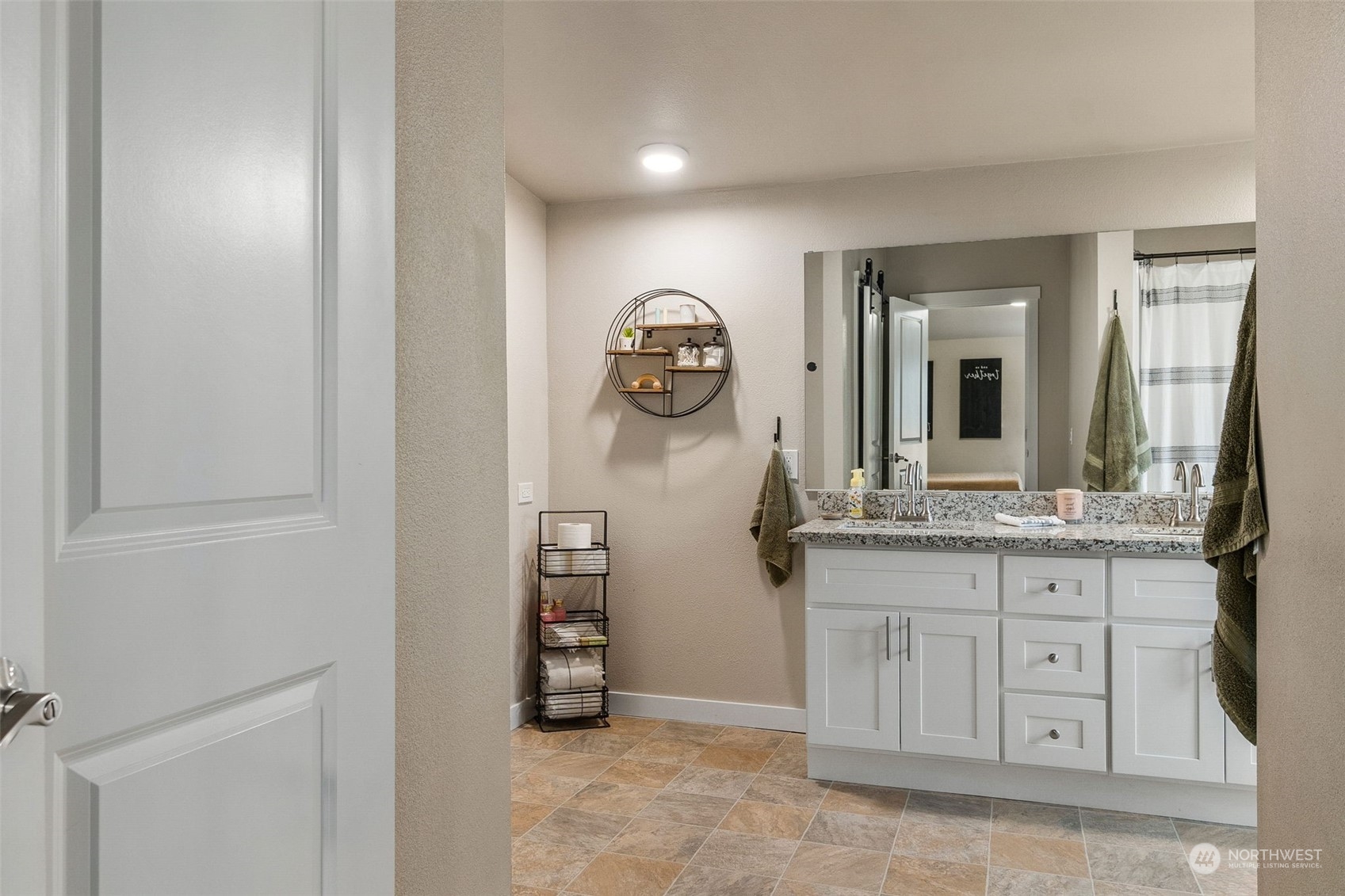 19025 Marble Street Southwest Rochester, WA 98579 - Photo 14 of 26 a bathroom with a granite countertop sink and a mirror
