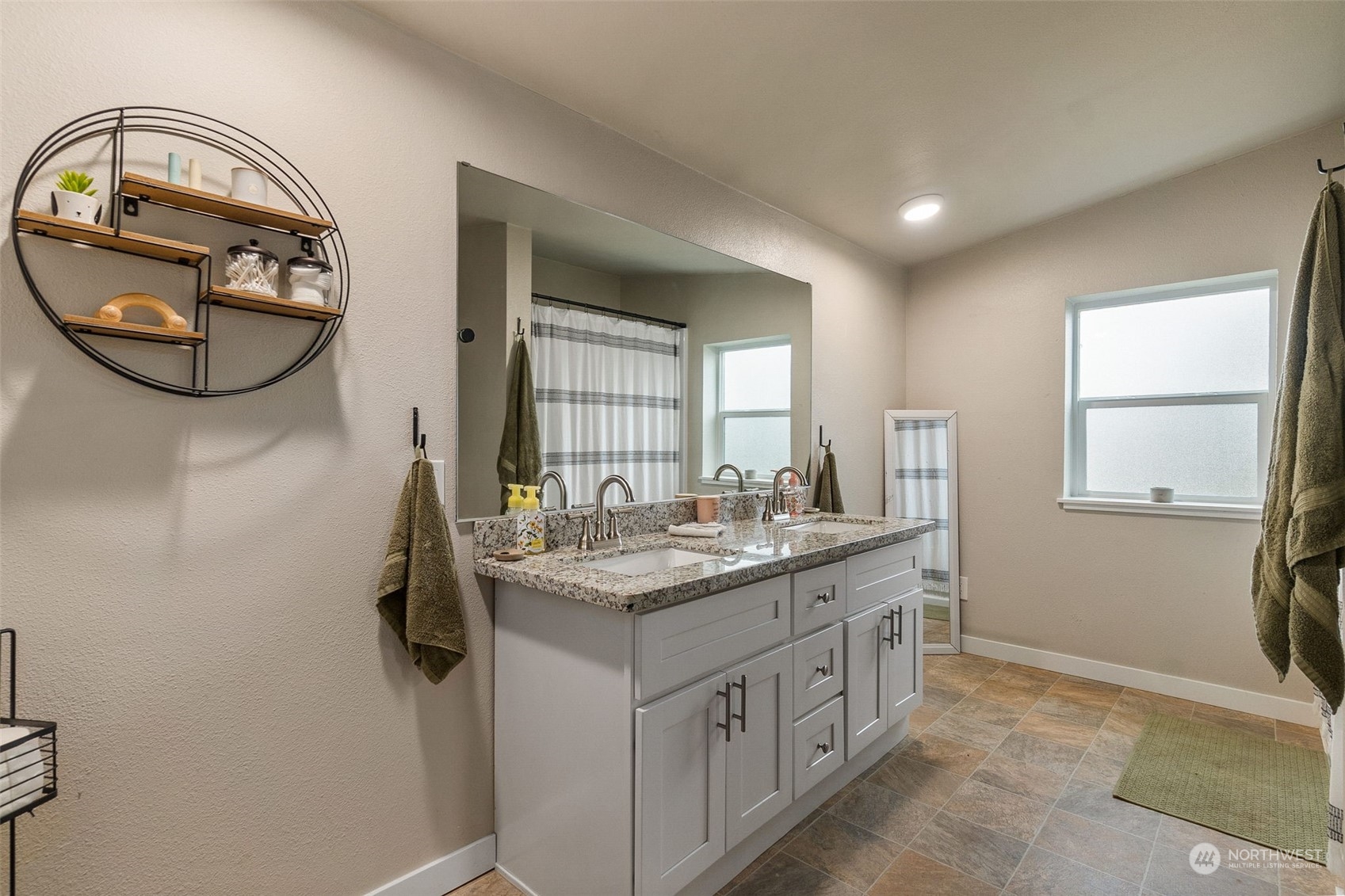 19025 Marble Street Southwest Rochester, WA 98579 - Photo 15 of 26 a bathroom with a granite countertop sink a mirror and a window