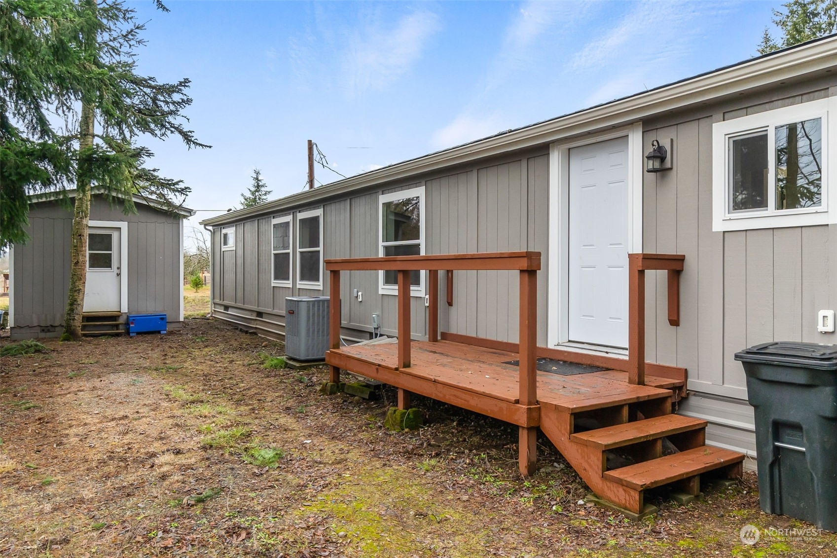 19025 Marble Street Southwest Rochester, WA 98579 - Photo 25 of 26 a view of a house with backyard and wooden fence