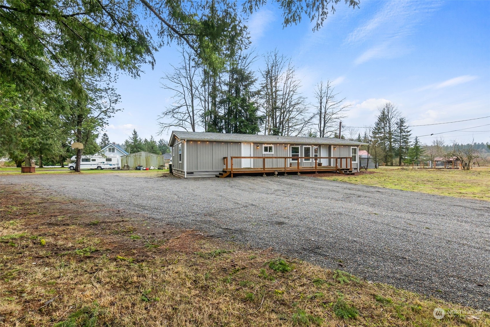 19025 Marble Street Southwest Rochester, WA 98579 - Photo 4 of 26 a view of swimming pool next to a yard and lake view