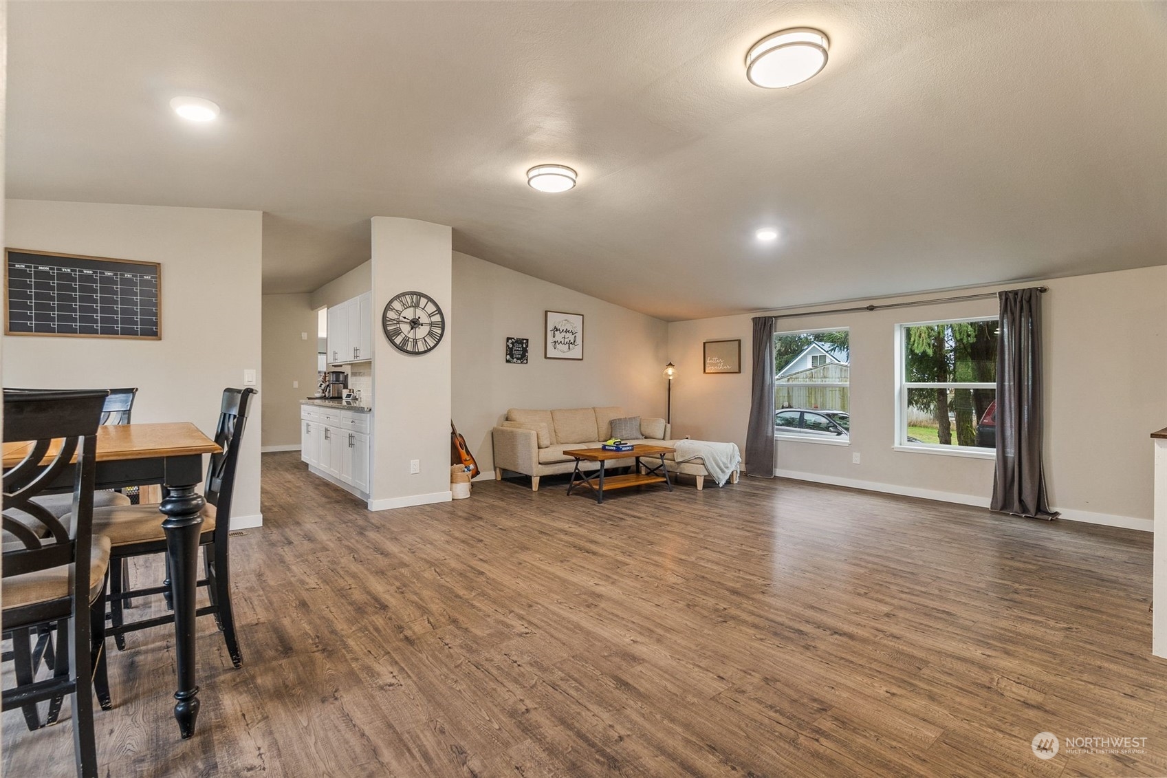 19025 Marble Street Southwest Rochester, WA 98579 - Photo 7 of 26 a view of a livingroom with furniture and a table wooden floor
