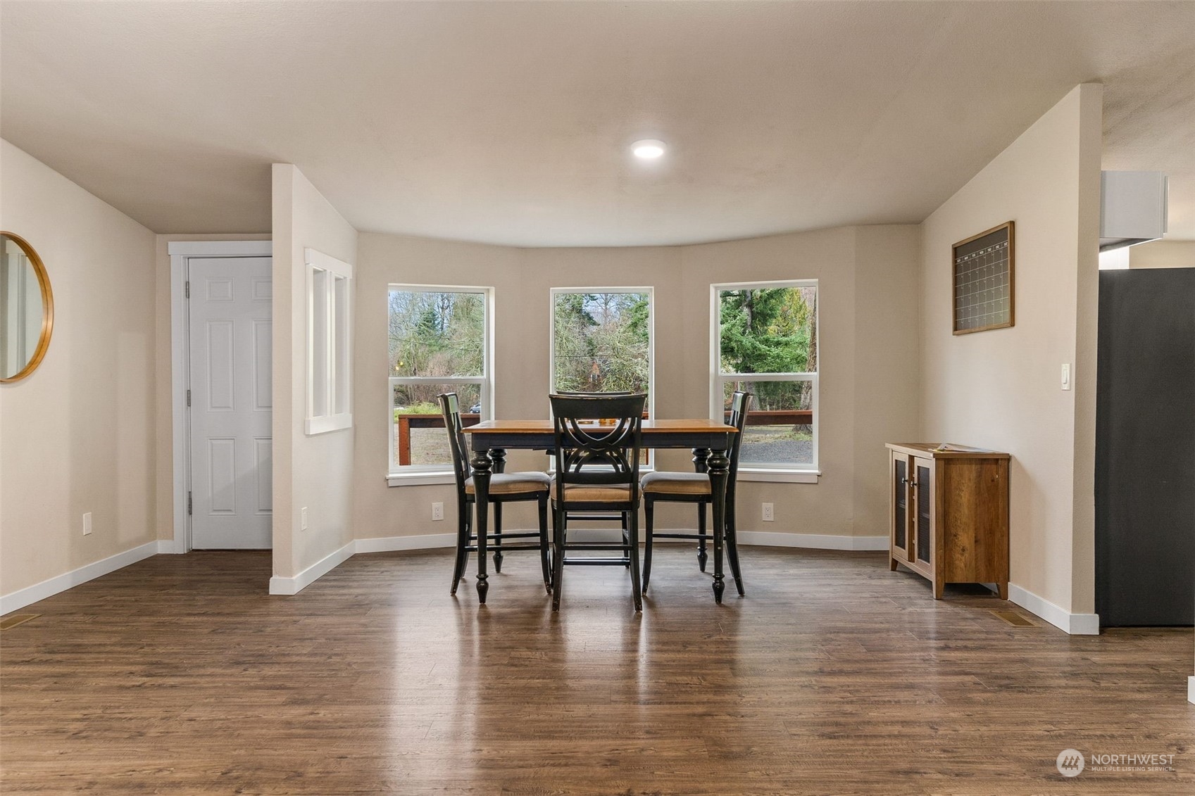 19025 Marble Street Southwest Rochester, WA 98579 - Photo 10 of 26 a view of a dining room with furniture window and wooden floor