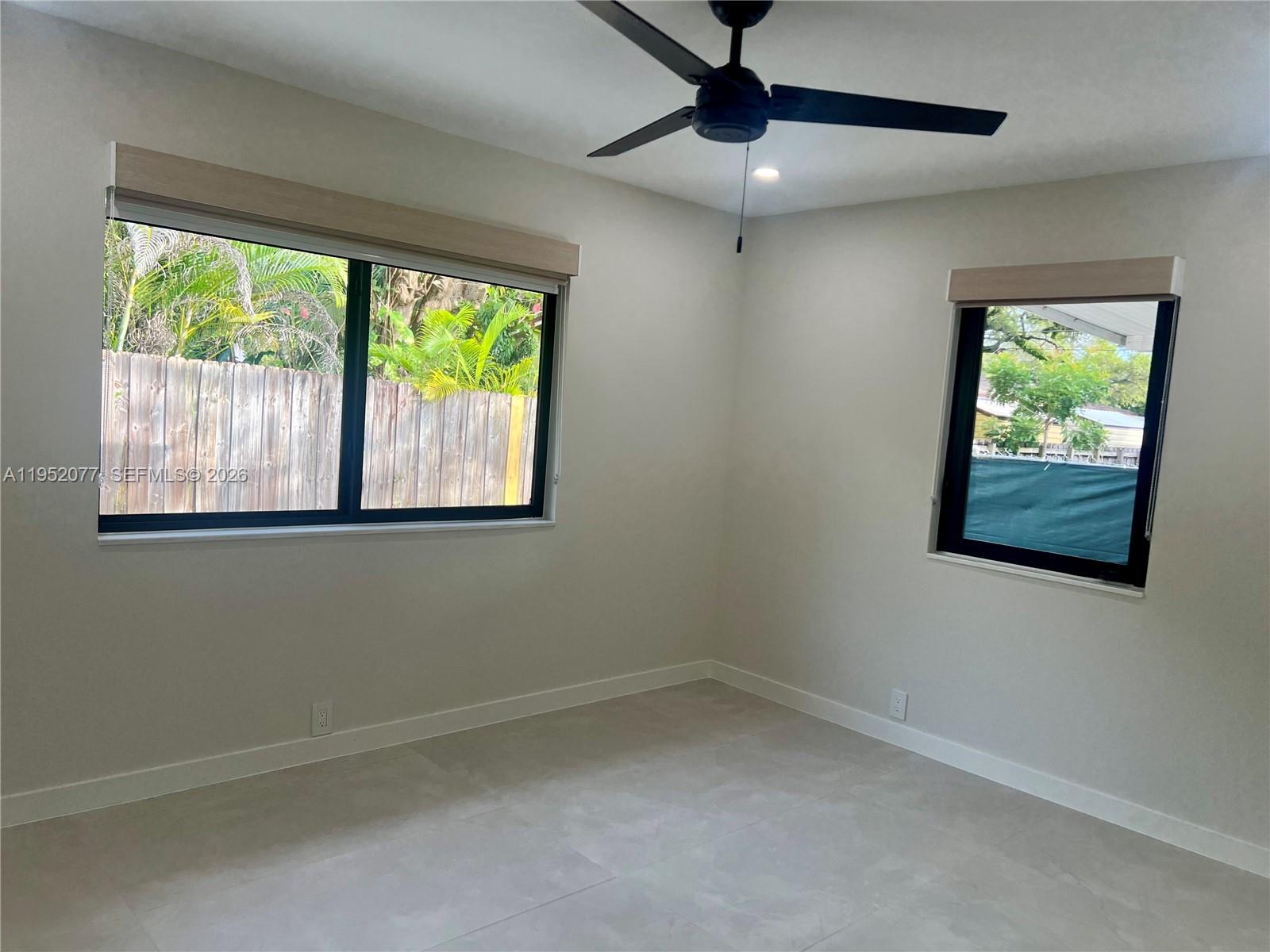 3532 Thomas Avenue, Unit 3532 Miami, FL 33133 - Photo 13 of 24 a view of an empty room with a window