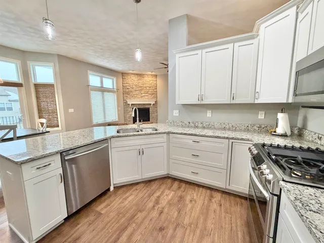 a kitchen with appliances cabinets and a sink