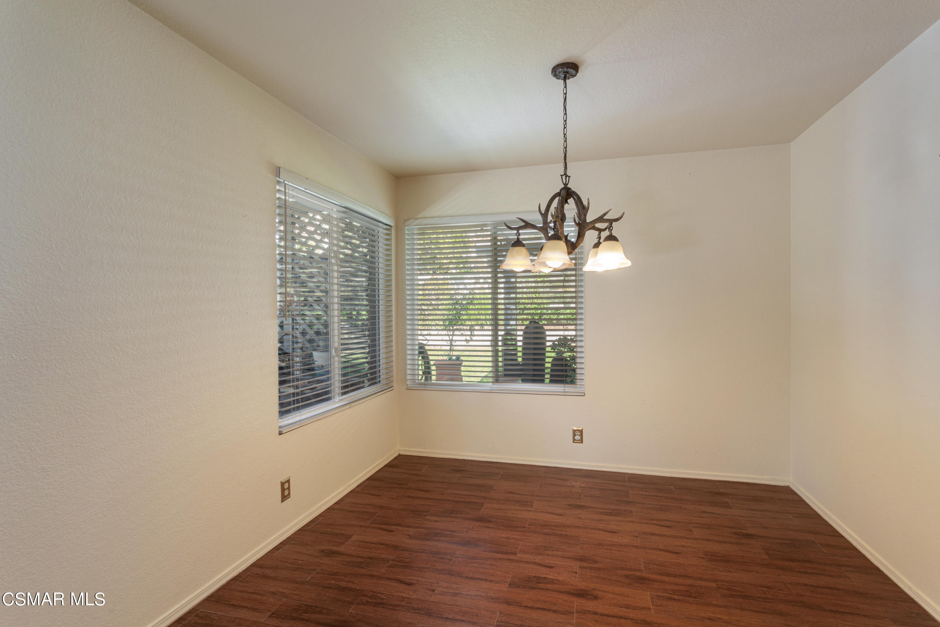 833 Congressional Road Simi Valley, CA 93065 - Photo 8 of 30 a view of a room with wooden floor chandelier and windows