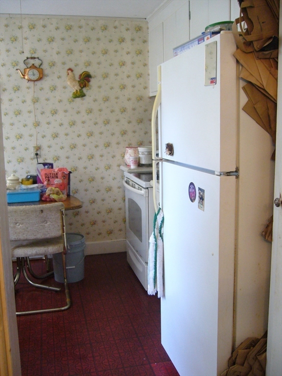 33 Sherwood Road Springfield, MA 01119 - Photo 10 of 16 a kitchen with a refrigerator and a stove
