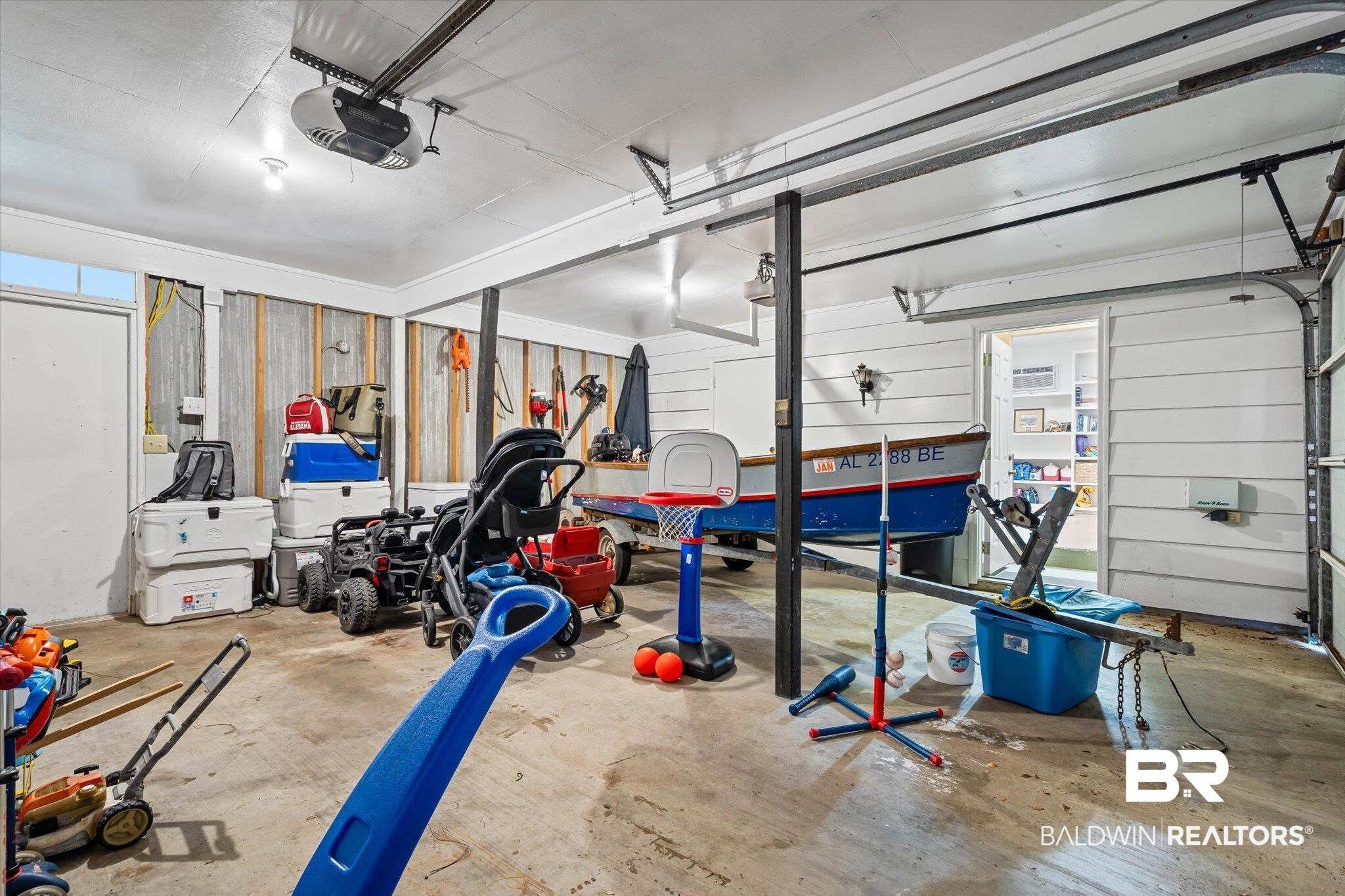 513 Spring Park Drive East Mobile, AL 36608 - Photo 33 of 44 Garage featuring a garage door opener