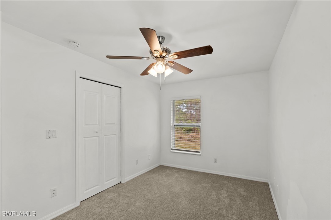 2009 Raber Court Lehigh Acres, FL 33972 - Photo 18 of 30 an empty room with windows and fan