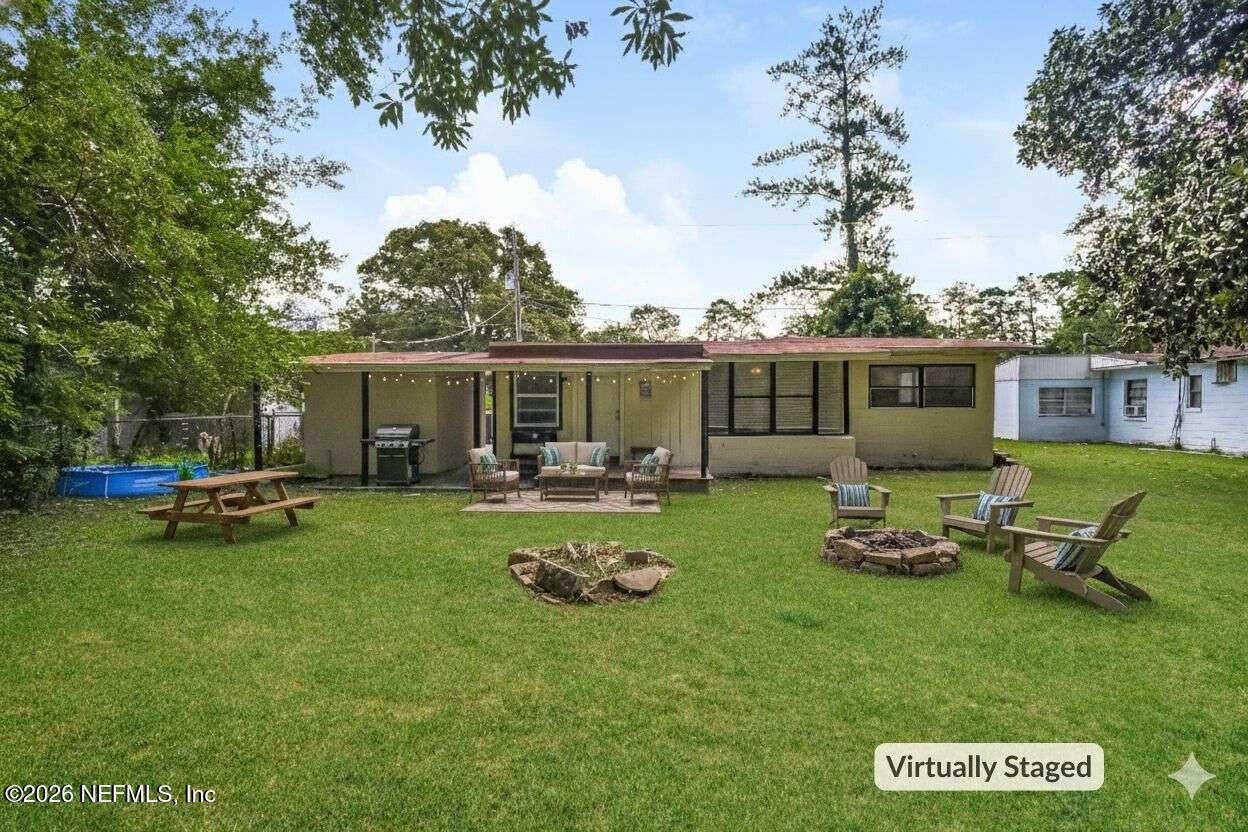 1480 Stimson Street Jacksonville, FL 32205 - Photo 20 of 21 a view of a house with backyard sitting area and garden