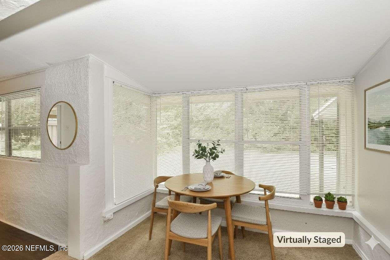 1480 Stimson Street Jacksonville, FL 32205 - Photo 6 of 21 a view of a dining room with furniture and a window