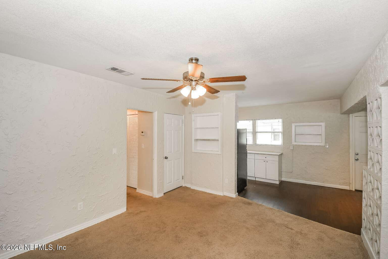 1480 Stimson Street Jacksonville, FL 32205 - Photo 8 of 21 a view of a chandelier fan and fire place