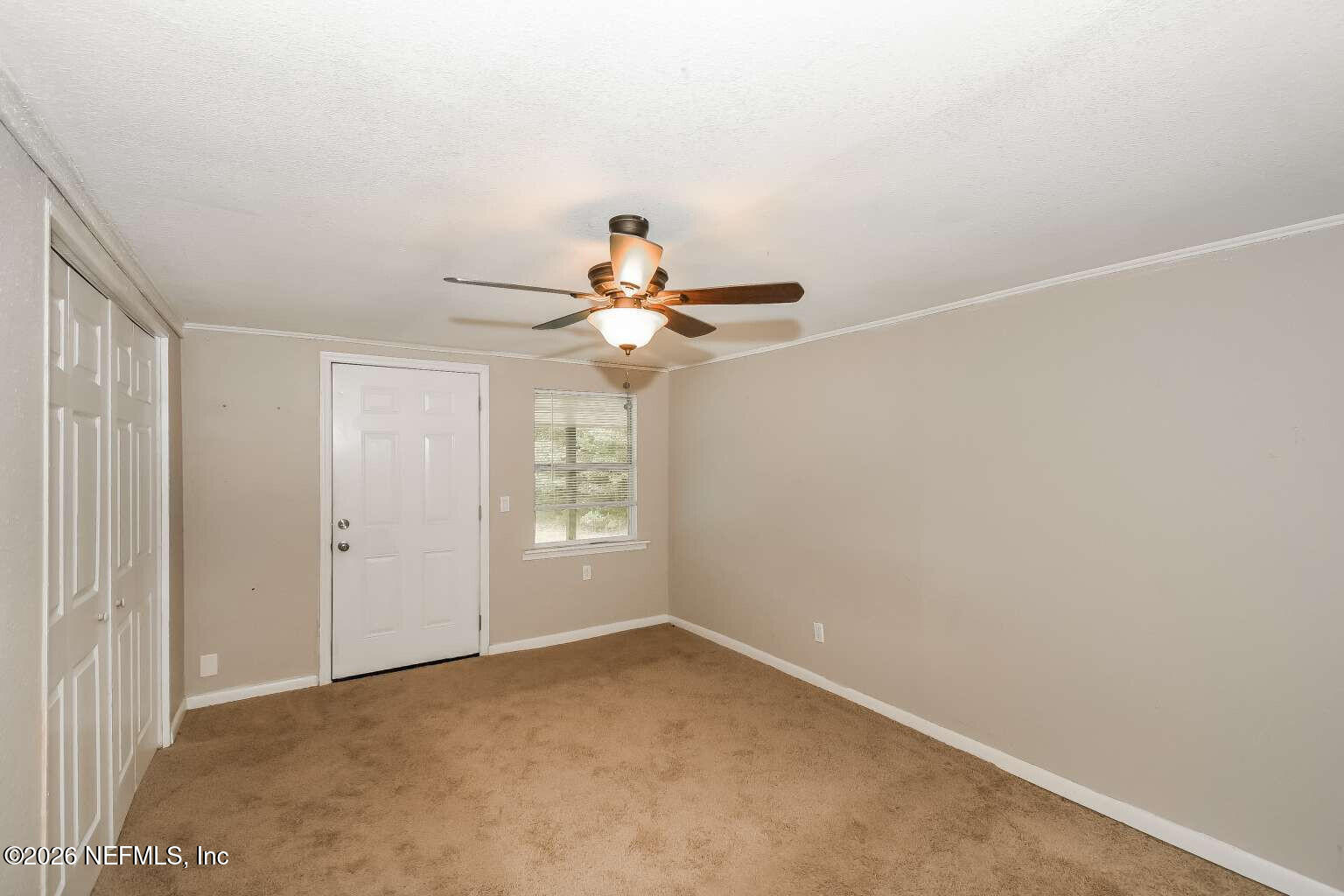 1480 Stimson Street Jacksonville, FL 32205 - Photo 10 of 21 an empty room with windows and fan