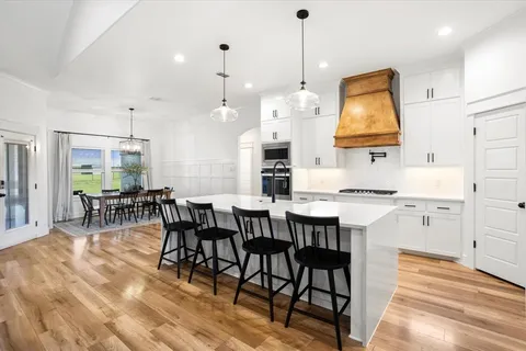 a view of kitchen with cabinets and wooden floor