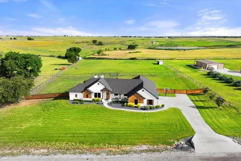 a view of a swimming pool with an outdoor space and seating area