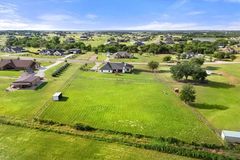 a view of a city with lots of residential buildings ocean and mountain view