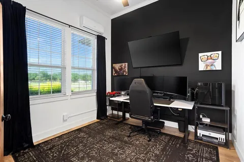 a workspace with furniture and a flat screen tv