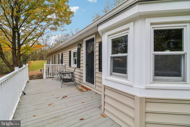 a living room with furniture window and wooden floor