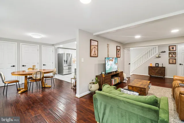 a kitchen with stainless steel appliances kitchen island granite countertop a refrigerator and a stove top oven