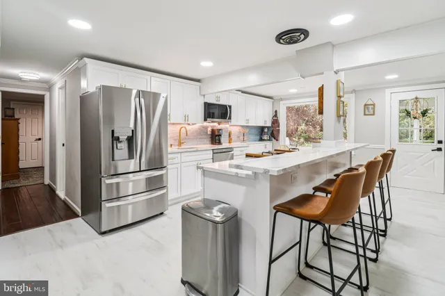 a view of a livingroom with furniture and gym equipment