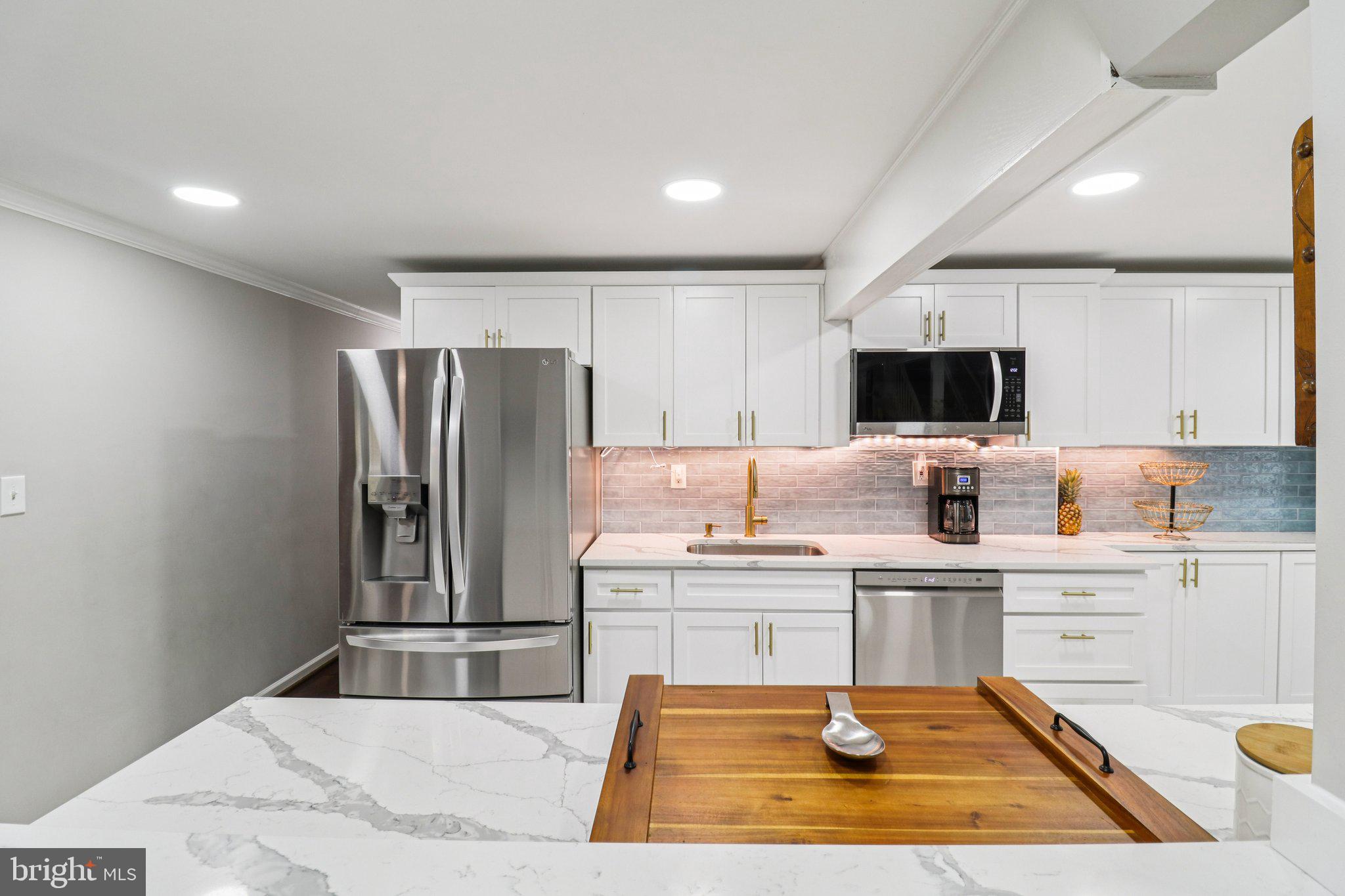 9830 Wineberry Road Marshall, VA 20115 - Photo 30 of 105 a kitchen with a sink stainless steel appliances and cabinets
