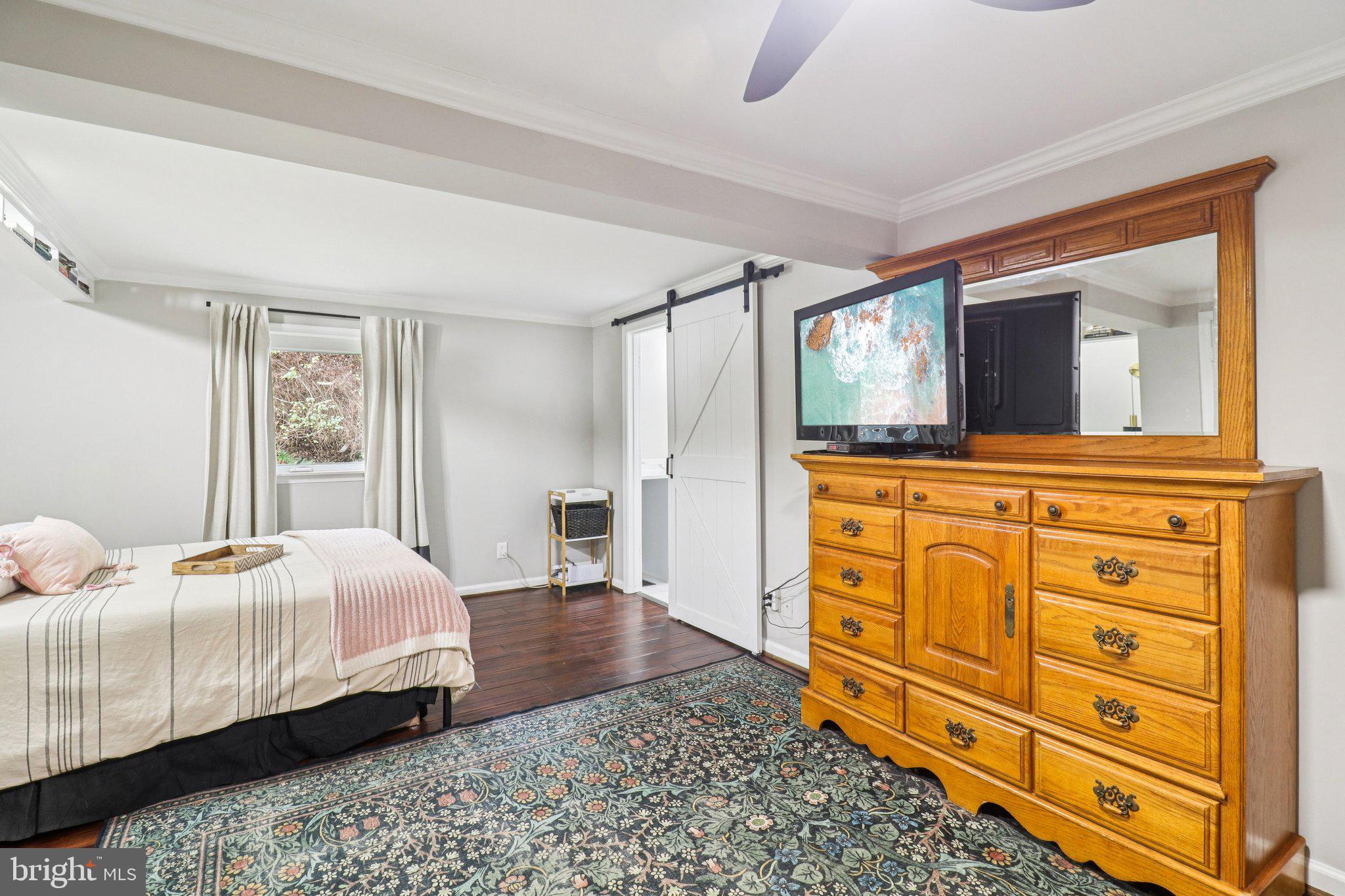 9830 Wineberry Road Marshall, VA 20115 - Photo 34 of 105 a bedroom with a bed and wooden floor
