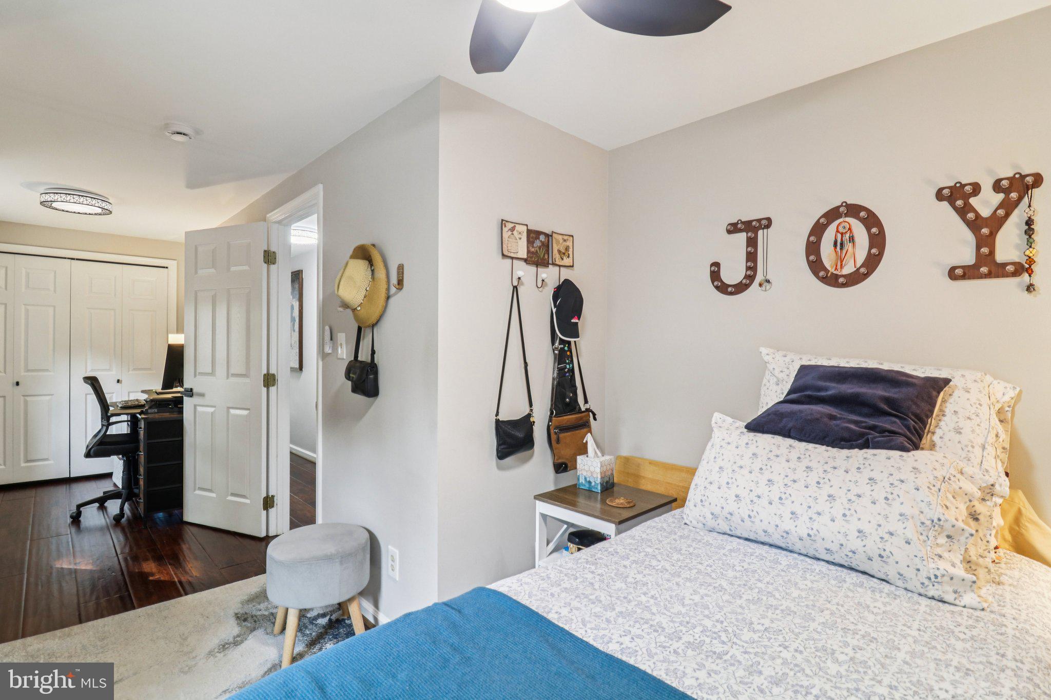 9830 Wineberry Road Marshall, VA 20115 - Photo 42 of 105 a bedroom with a bed and a table
