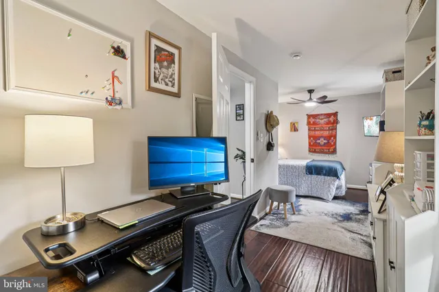 a bedroom with a bed and glass door