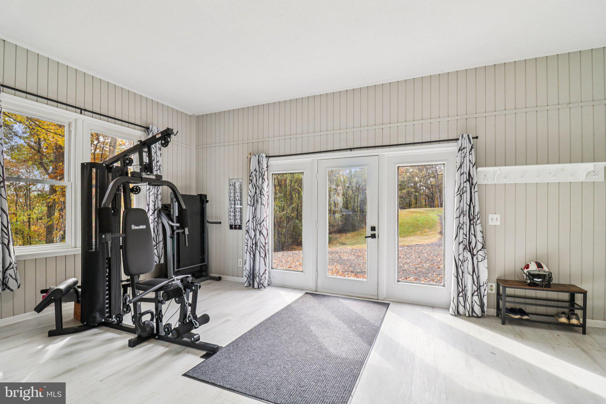9830 Wineberry Road Marshall, VA 20115 - Photo 45 of 105 a view of a livingroom with furniture and gym equipment