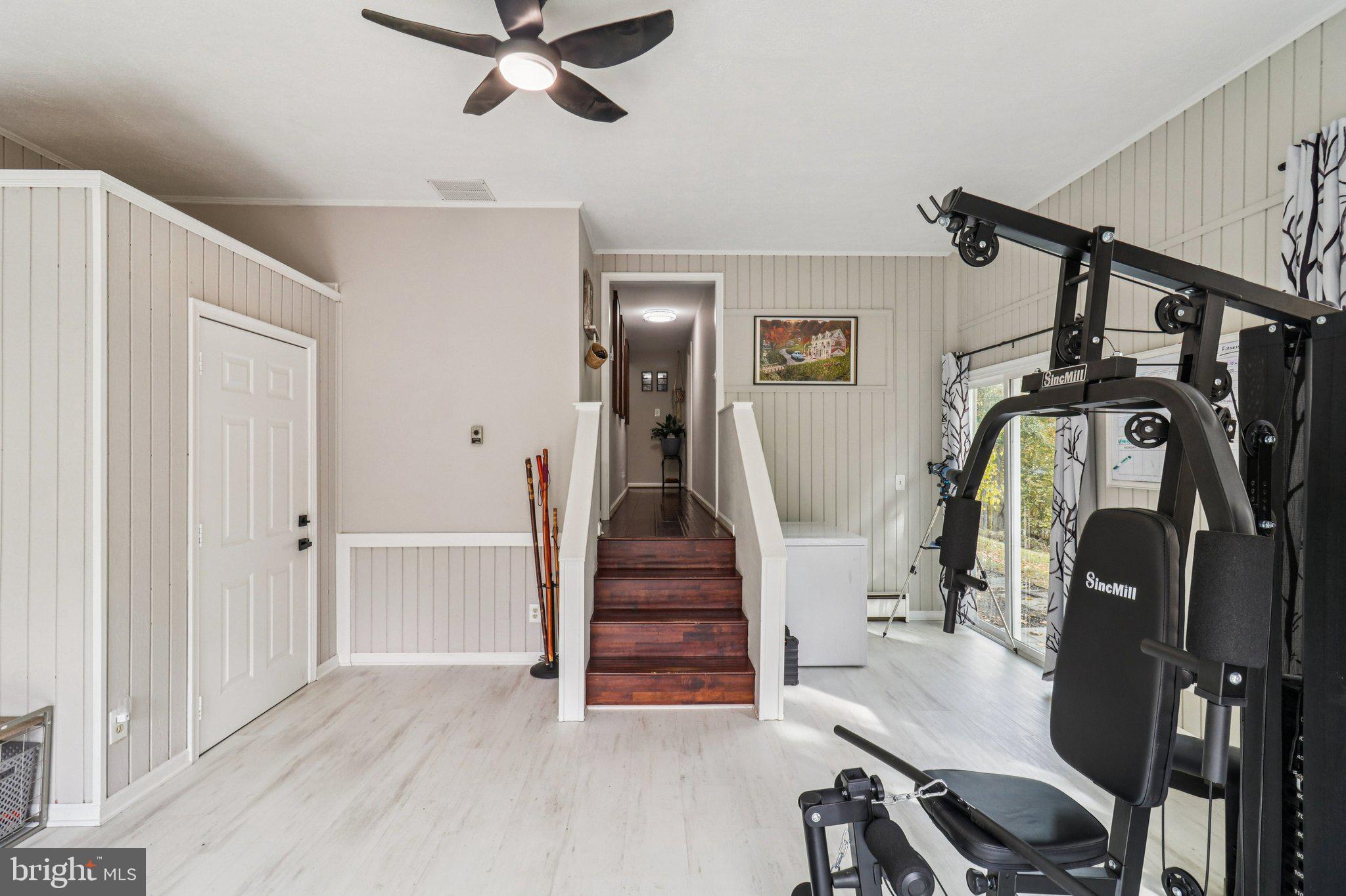 9830 Wineberry Road Marshall, VA 20115 - Photo 47 of 105 a view of a hallway with wooden floor and windows