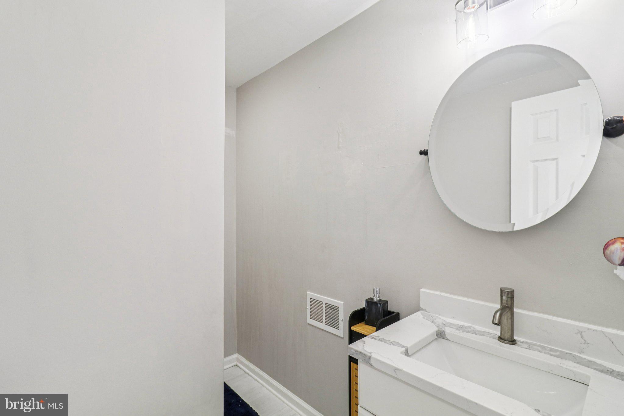9830 Wineberry Road Marshall, VA 20115 - Photo 54 of 105 a bathroom with a sink and mirror