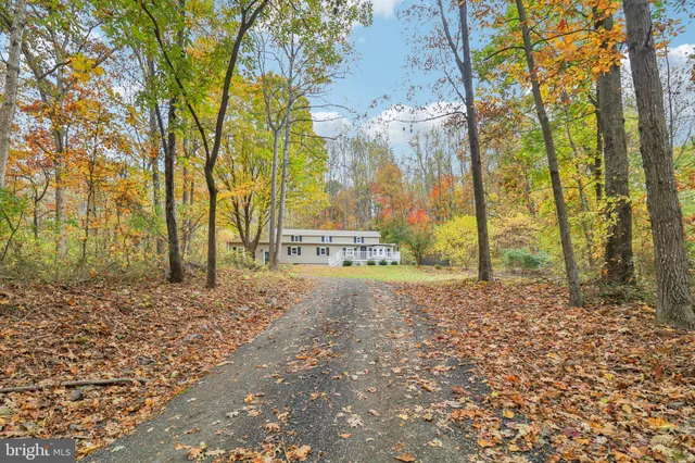 a front view of a house with entryway and windows