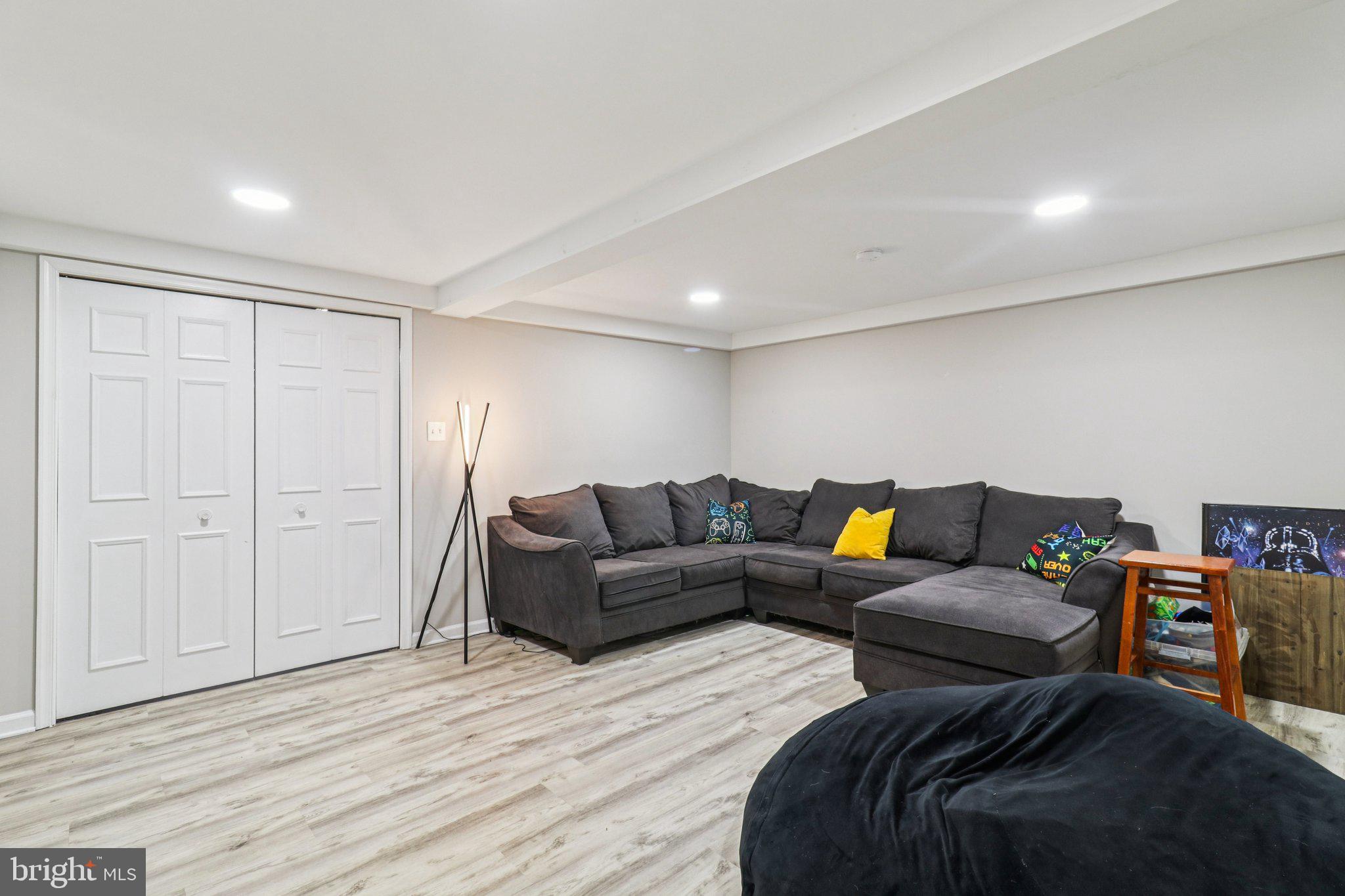 9830 Wineberry Road Marshall, VA 20115 - Photo 61 of 105 a living room with furniture and a wooden floor