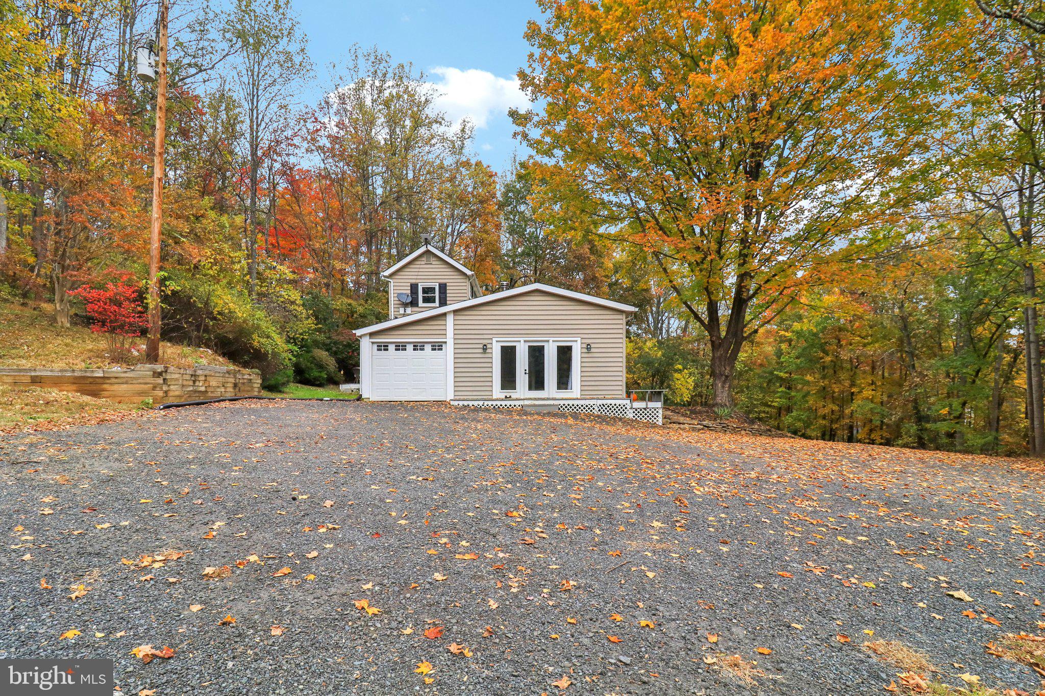 9830 Wineberry Road Marshall, VA 20115 - Photo 69 of 105 a house with trees in front of it